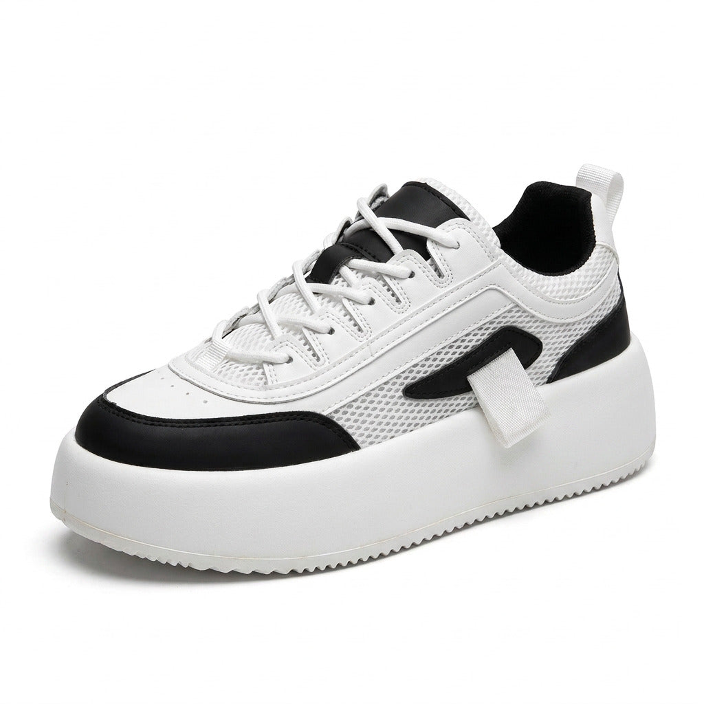 Man wearing height-boosting sports sneakers outdoors.